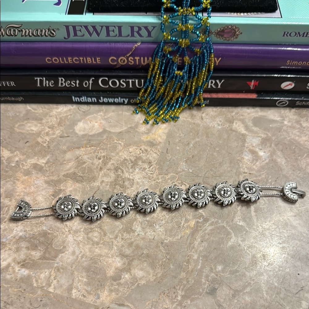 Awesome Silvertone sliding sun bracelet eight sons fold over clasp
